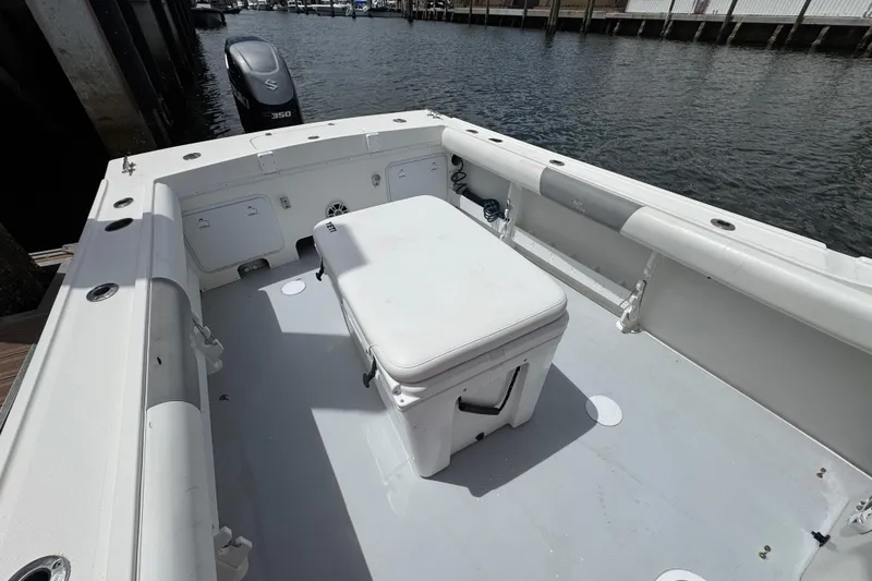 Slide: The Image of 2019 Steiger Craft 255 Miami boat deck with seating and Suzuki outboard motor. - 11