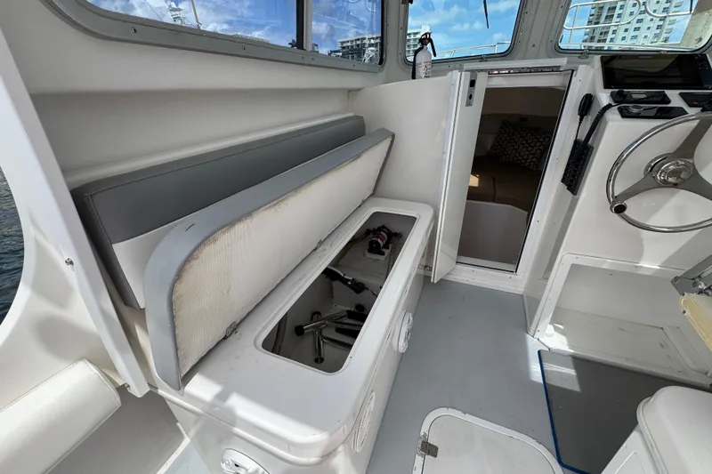 Slide: The Image of 2019 Steiger Craft 255 Miami boat interior with storage compartment open. - 15