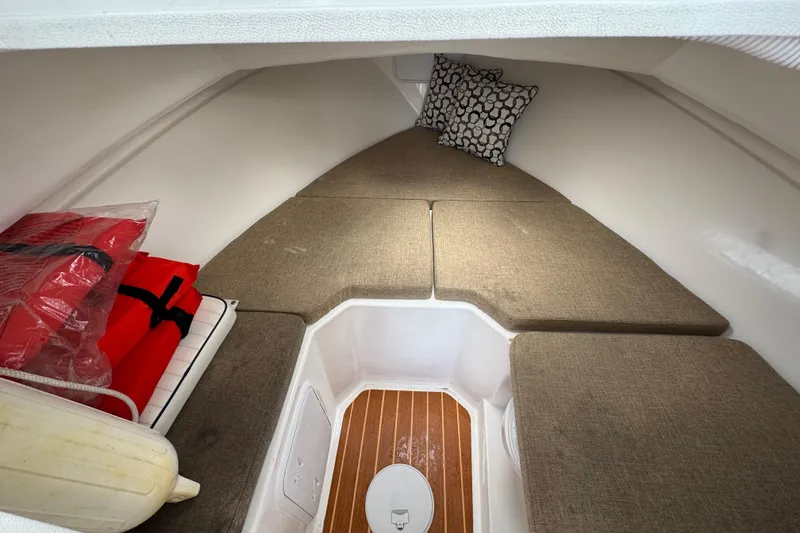 Slide: The Image of 2019 Steiger Craft 255 Miami cabin interior with cushions and safety equipment. - 20