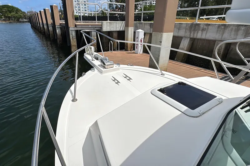 Slide: The Image of 2019 Steiger Craft 255 Miami boat docked at marina, showcasing bow and railing. - 24