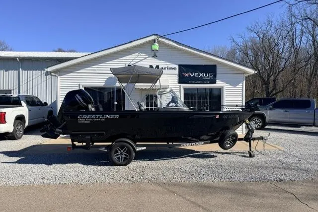 Slide: The Image of 2022 Crestliner 1750 Fish Hawk SE boat parked outside a marine dealership. - 11