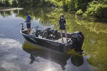 Slide: The Image of Manufacturer Provided Image: 2022 Crestliner 1750 Fish Hawk SE boat on a calm lake with two people fishing. - 3