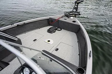 Slide: The Image of Manufacturer Provided Image: 2022 Crestliner 1750 Fish Hawk SE boat on water, featuring spacious deck and trolling motor. - 5