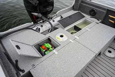 Slide: The Image of Manufacturer Provided Image: 2022 Crestliner 1750 Fish Hawk SE boat with open storage compartments and motor. - 8