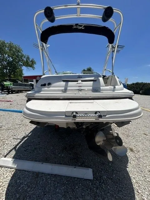 Slide: The Image of Rear view of a 2006 Sea Ray 240 Sundeck boat on gravel. - 10