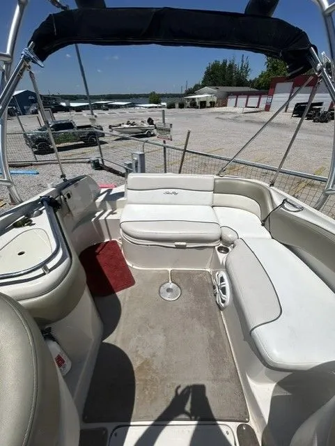 Slide: The Image of Interior of a 2006 Sea Ray 240 Sundeck boat at the marina. - 13