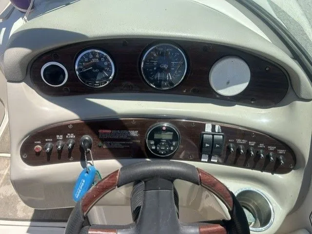 Slide: The Image of Dashboard of a 2006 Sea Ray 240 Sundeck boat. - 14