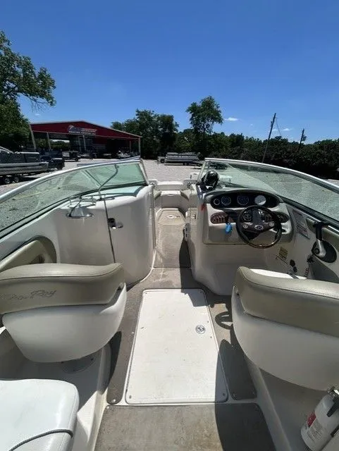 Slide: The Image of Interior view of a 2006 Sea Ray 240 Sundeck boat under sunny skies. - 17