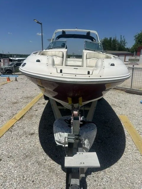 Slide: The Image of 2006 Sea Ray 240 Sundeck boat parked on a trailer. - 5