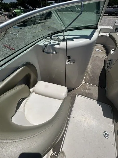 Slide: The Image of Interior of a 2006 Sea Ray 240 Sundeck boat with seating area. - 7