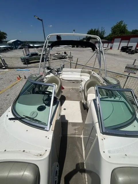 Slide: The Image of 2006 Sea Ray 240 Sundeck boat with open cockpit and seating. - 9