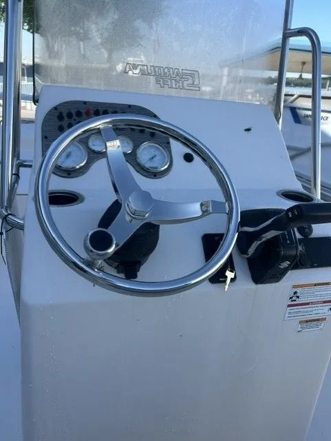 Slide: The Image of Steering console of a 2025 Carolina Skiff 21 LS boat. - 11