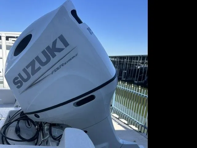 Slide: The Image of Suzuki 150HP outboard motor on Carolina Skiff 21 LS, 2025 model. - 12