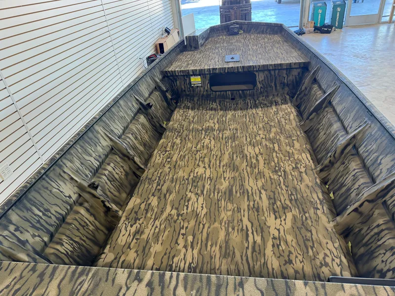 Slide: The Image of Interior view of SeaArk 1648 Special boat with camouflage pattern, year 2025. - 7