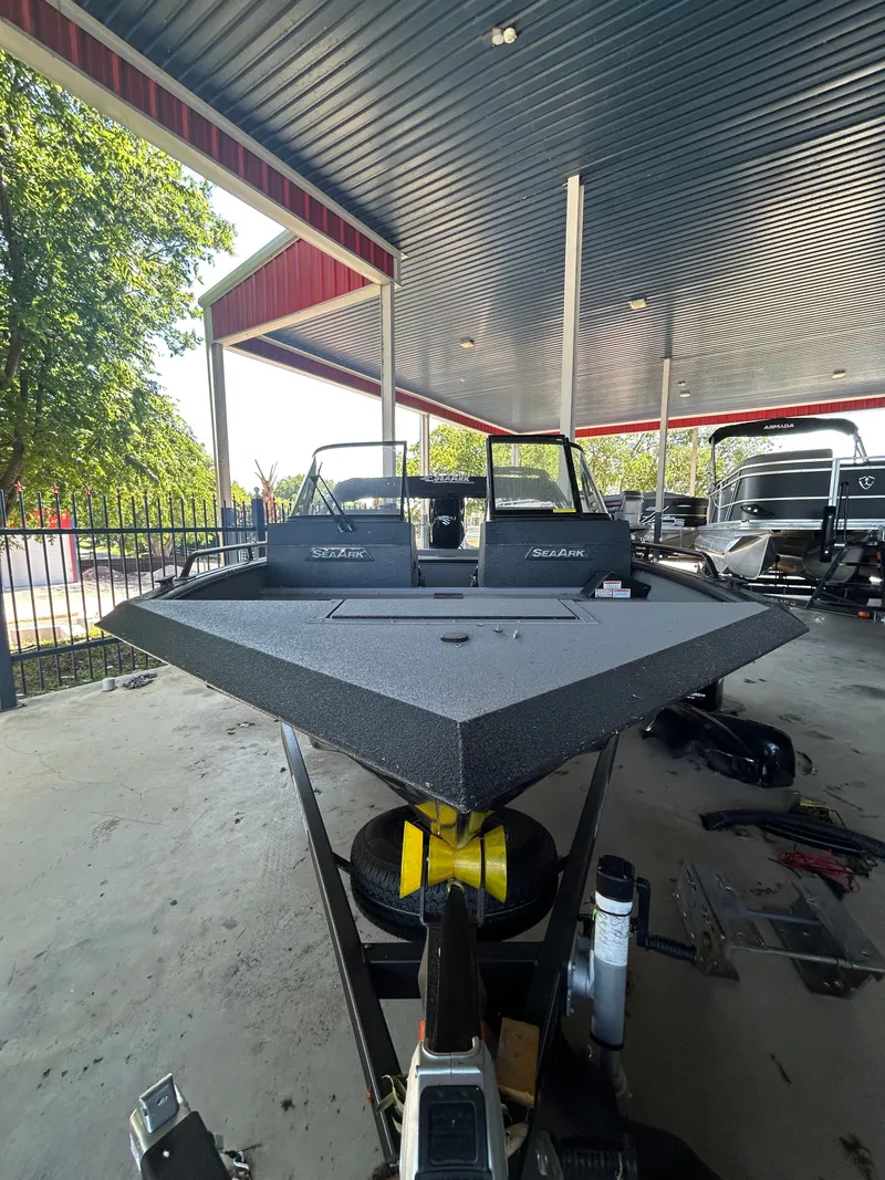 Slide: The Image of 2026 SeaArk Protege boat with 200HP Suzuki and tandem axle trailer. - 8