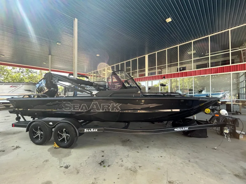 Slide: The Image of 2026 SeaArk Protege boat with 200HP Suzuki and tandem axle trailer. - 9
