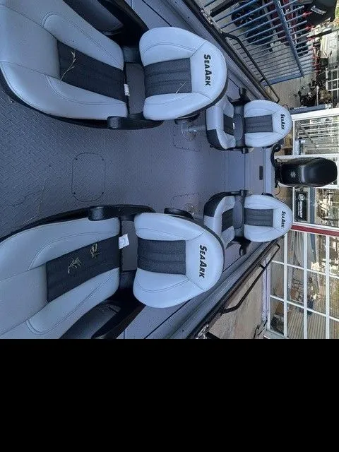Slide: The Image of Interior view of SeaArk PROCAT 240 boat with gray seats. - 15