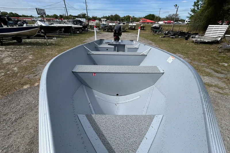 Slide: The Image of 2026 Crestliner 1672 Outreach boat displayed outdoors, showcasing spacious interior and sleek design. - 5