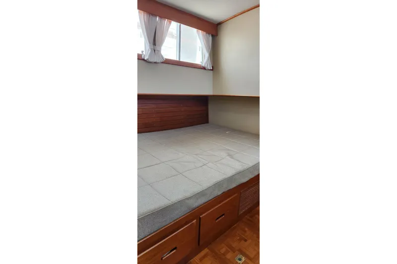 Slide: The Image of Cozy cabin bed with storage in 1987 Grand Banks 36 Classic yacht. - 17