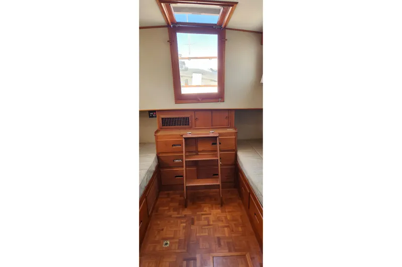 Slide: The Image of Interior of 1987 Grand Banks 36 Classic yacht with wooden cabinetry and skylight. - 19