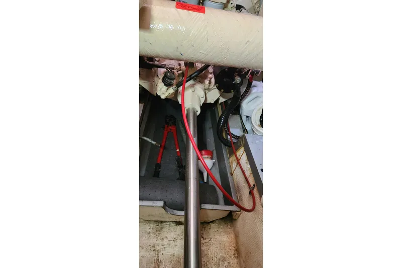 Slide: The Image of Engine room of 1987 Grand Banks 36 Classic with visible tools and components. - 21