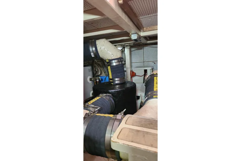 Slide: The Image of Engine room of 1987 Grand Banks 36 Classic boat with visible piping and equipment. - 31