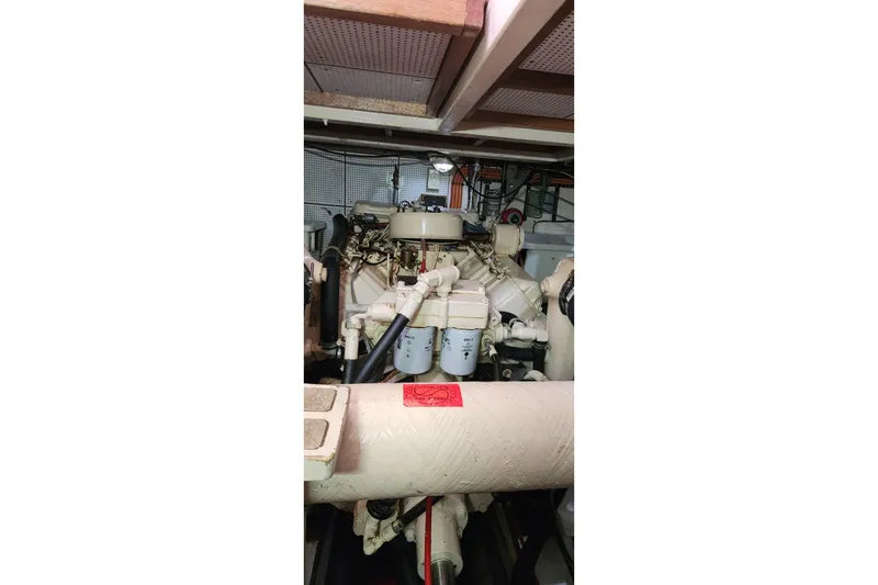 Slide: The Image of Engine room of 1987 Grand Banks 36 Classic boat, showcasing mechanical components. - 32