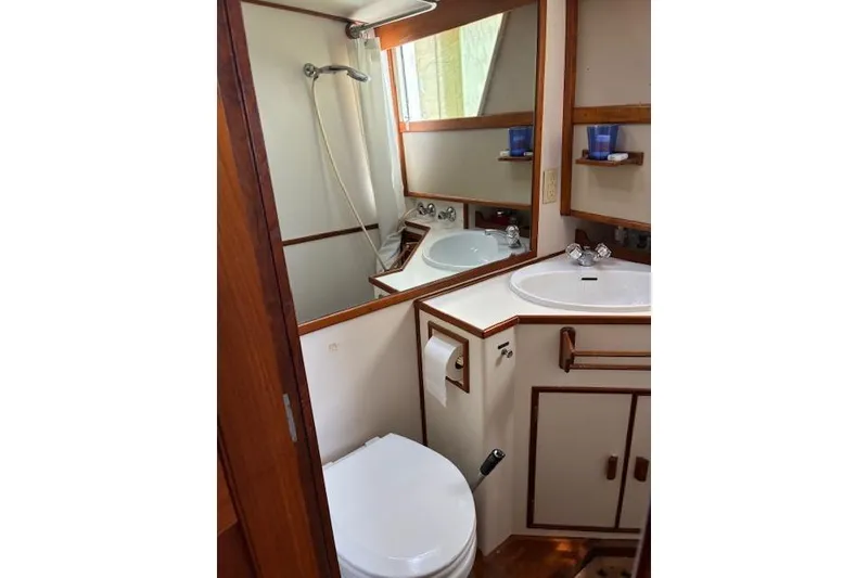 Slide: The Image of Bathroom interior of 1987 Grand Banks 36 Classic yacht, featuring sink, toilet, and shower. - 40