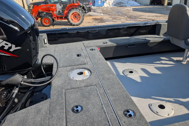 Slide: The Image of 2026 Starcraft Storm 176 DC Pro boat interior with Mercury engine and seating. - 5