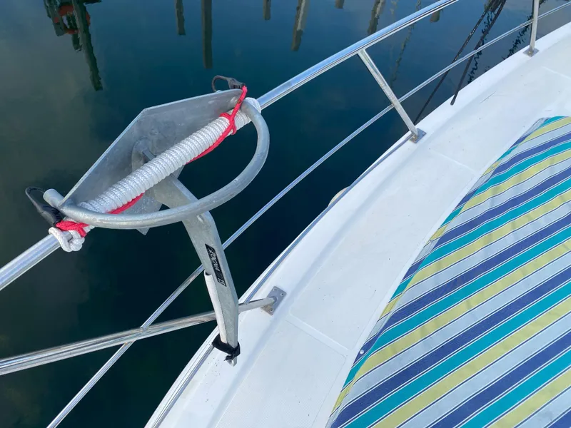 Slide: The Image of Close-up of the bow of a 2000 Carver 396 Motor Yacht with anchor and striped cushion. - 10