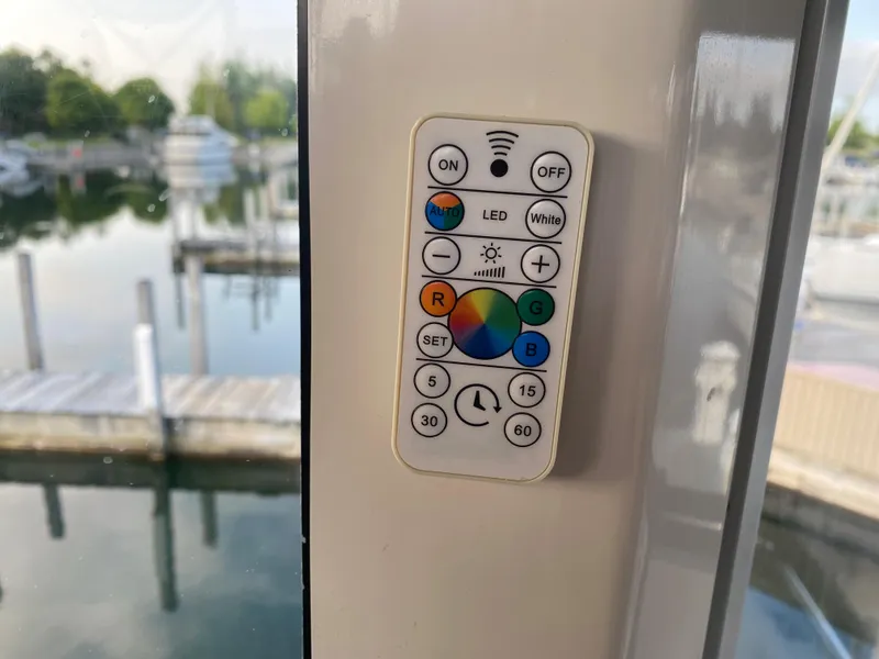 Slide: The Image of Remote control on a 2000 Carver 396 Motor Yacht, docked at a marina. - 13