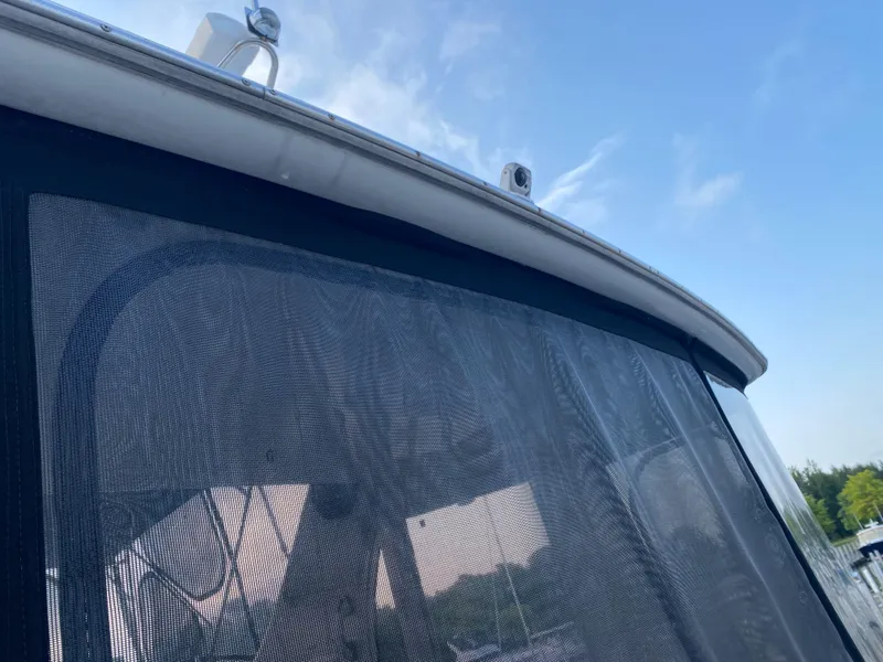 Slide: The Image of Close-up of 2000 Carver 396 Motor Yacht with mesh covering. - 15