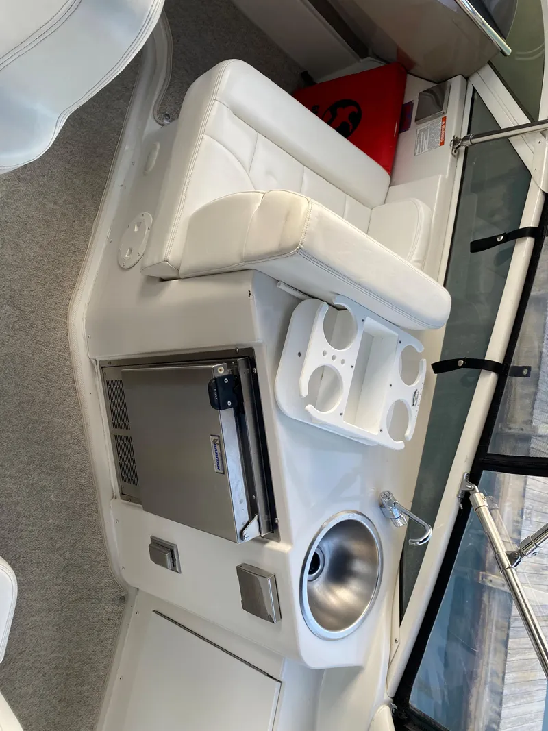 Slide: The Image of 2000 Carver 396 Motor Yacht interior with sink and mini fridge. - 17