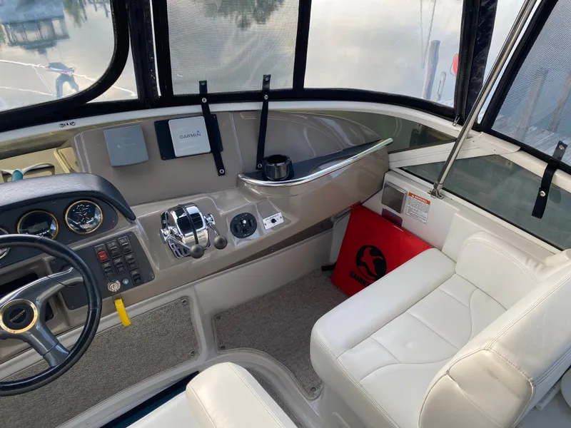 Slide: The Image of Interior helm of a 2000 Carver 396 Motor Yacht with steering wheel and control panel. - 19