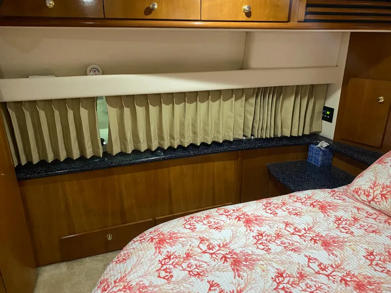 Slide: The Image of Interior cabin of 2000 Carver 396 Motor Yacht with wood cabinetry and bed. - 25