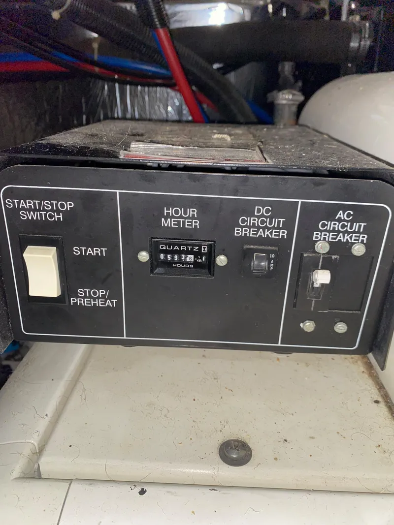 Slide: The Image of Control panel of a 2000 Carver 396 Motor Yacht with hour meter and circuit breakers. - 45