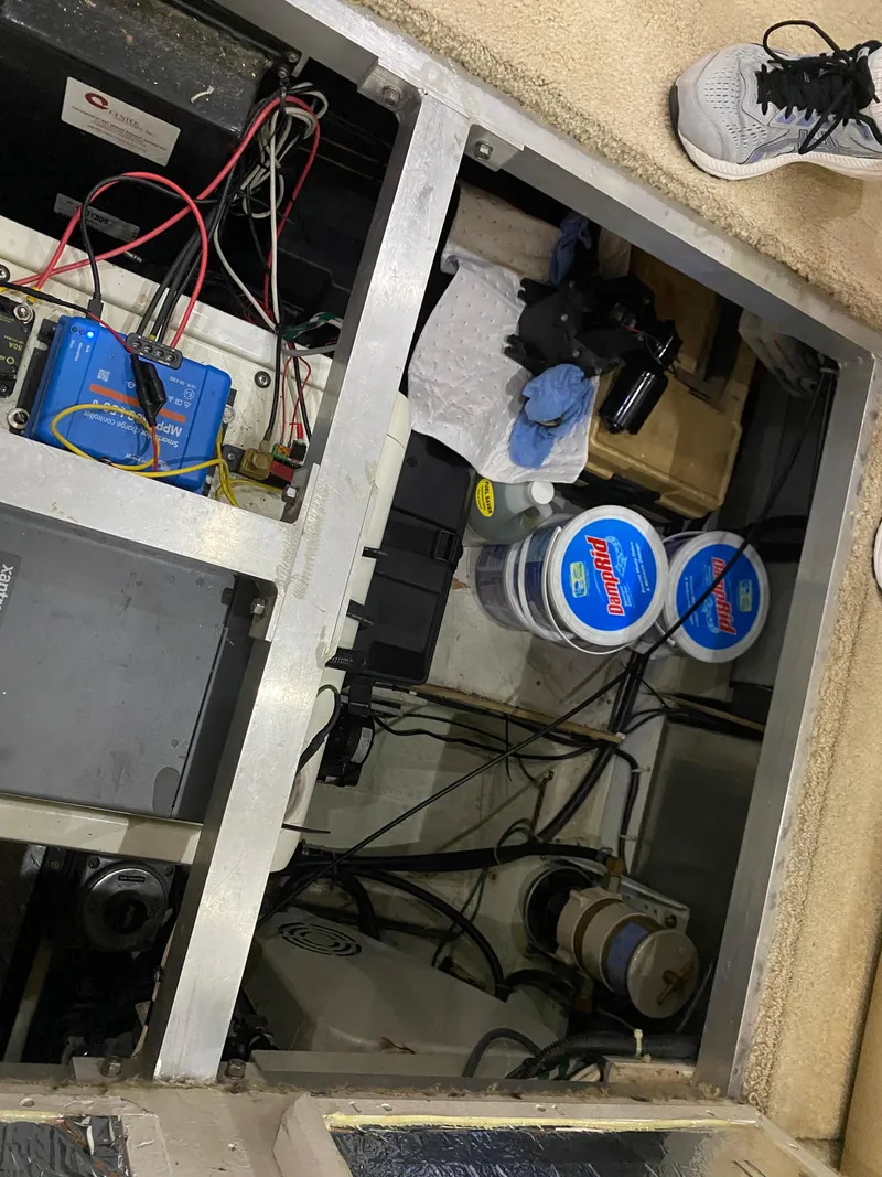 Slide: The Image of Engine compartment of a 2000 Carver 396 Motor Yacht with maintenance supplies. - 47