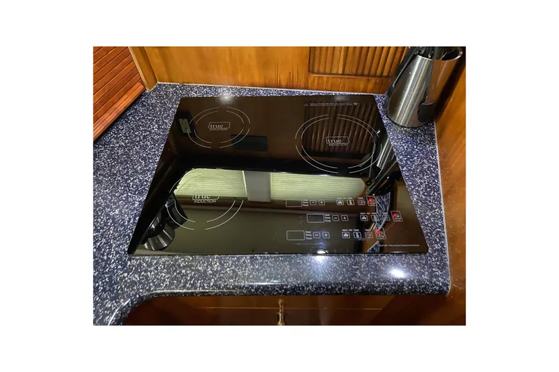 Slide: The Image of Modern stovetop in 2000 Carver 396 Motor Yacht kitchen. - 48