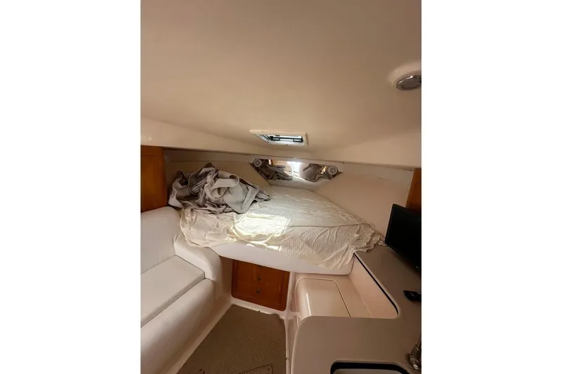 Slide: The Image of Interior cabin of 2004 Intrepid 377 Walkaround with bed and seating area. - 12