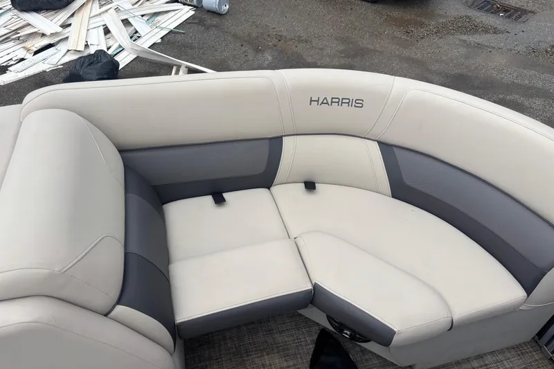 Slide: The Image of 2023 Harris Cruiser 190 boat seat with gray and white upholstery. - 10