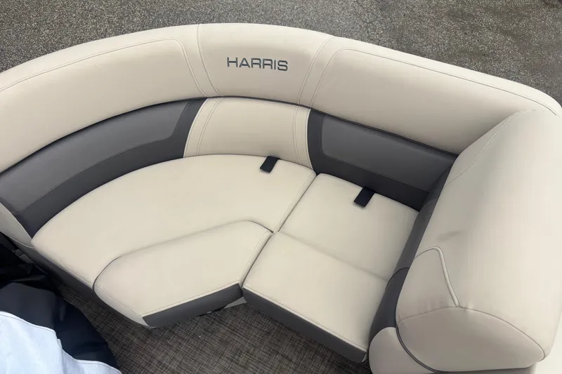 Slide: The Image of 2023 Harris Cruiser 190 seating area with beige upholstery. - 11