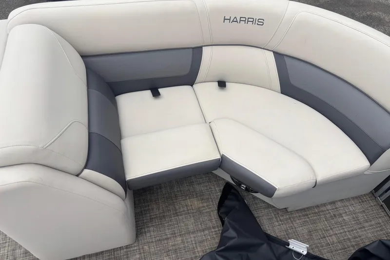 Slide: The Image of 2023 Harris Cruiser 190 seating area with gray and white upholstery. - 9