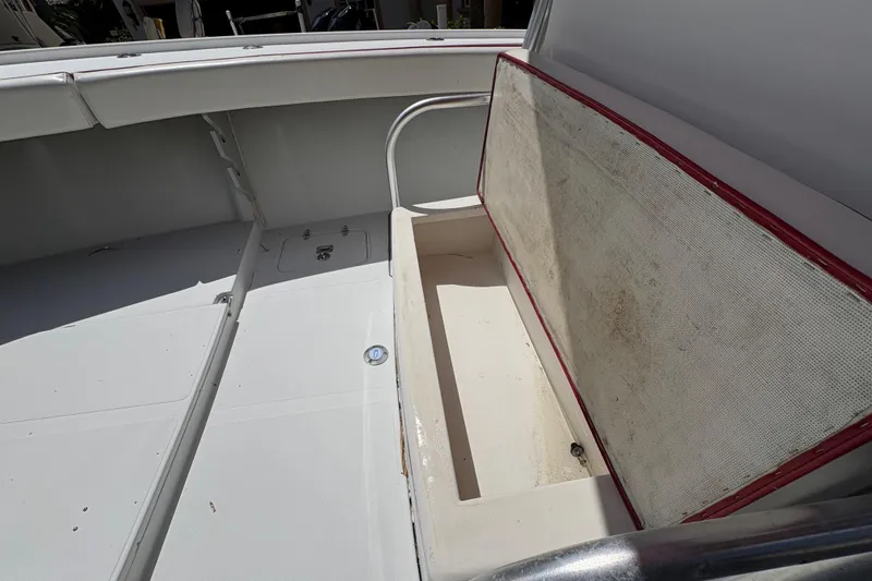 Slide: The Image of Open storage compartment on a 2002 Ocean Runner 30 boat, showcasing interior space. - 11