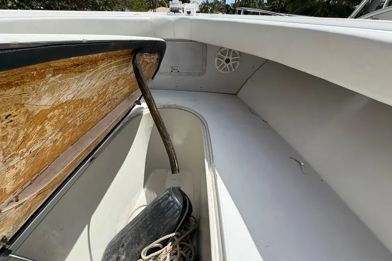Slide: The Image of Interior view of a 2002 Ocean Runner 30 boat, featuring storage compartment and speaker. - 12