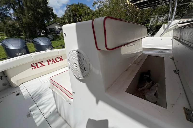 Slide: The Image of 2002 Ocean Runner 30 boat interior with storage compartment and twin 300 engines. - 20