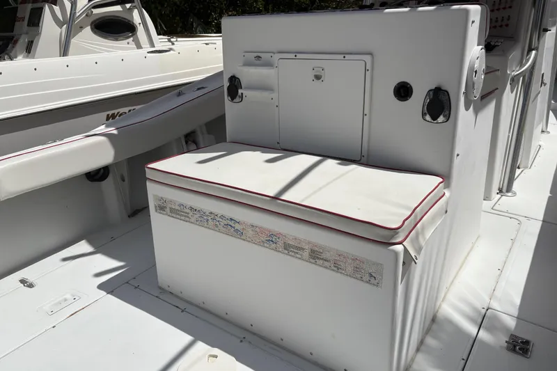 Slide: The Image of White seating area on a 2002 Ocean Runner 30 boat deck. - 22