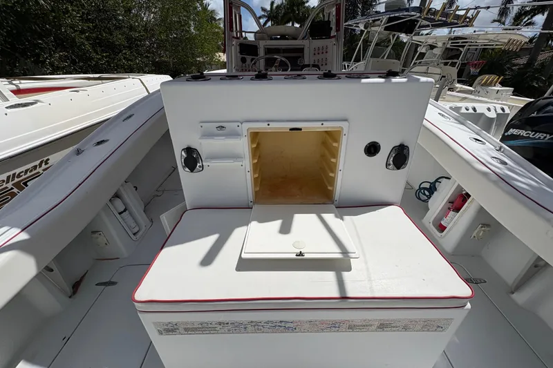 Slide: The Image of 2002 Ocean Runner 30 boat interior with storage compartment and seating area. - 23