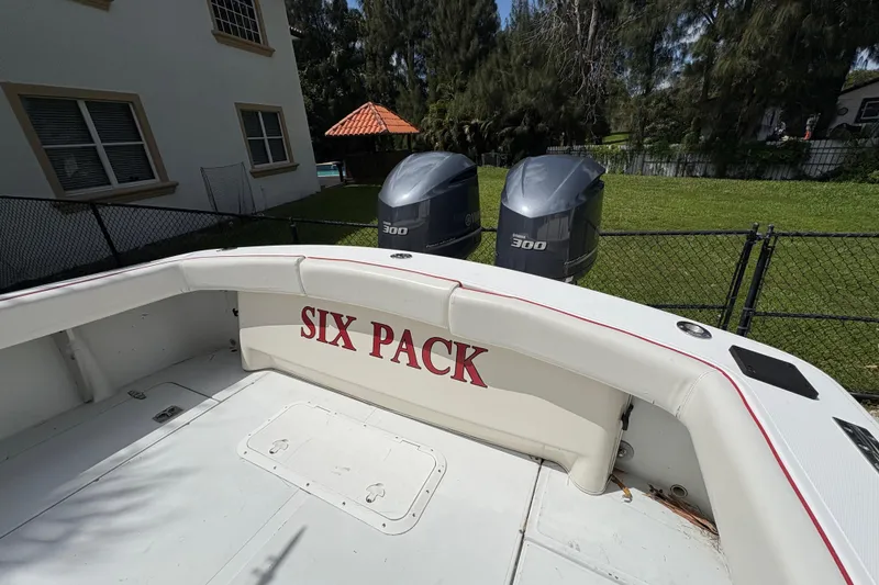 Slide: The Image of Ocean Runner 30 boat from 2002 with "Six Pack" text, dual 300 horsepower engines. - 26