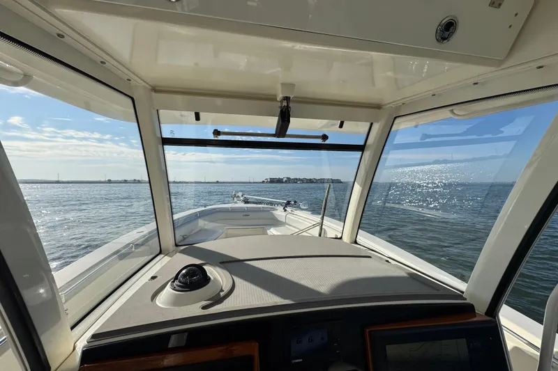 Slide: The Image of 2015 Cobia 344 Center Console boat interior view with ocean horizon. - 9
