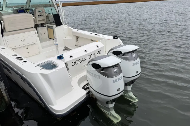 Slide: The Image of 2016 Boston Whaler 315 Conquest with twin Suzuki 350 engines, docked in Ocean City, MD. - 11